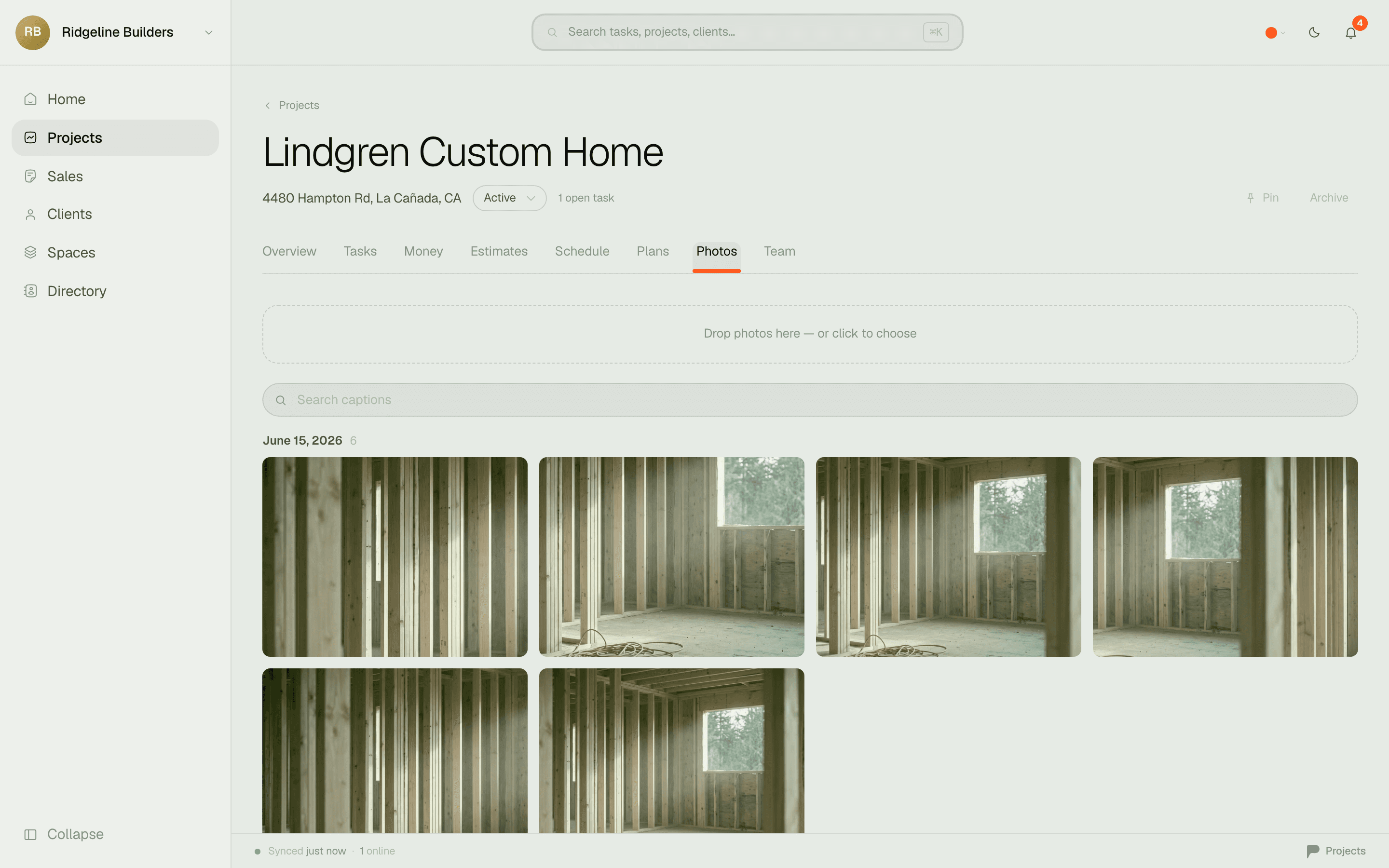 The Photos tab — a grid of jobsite framing photos on a project